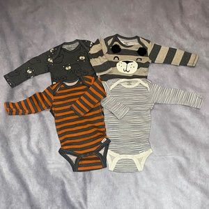 4 - Gerber Long-Sleeve Onesies in size 6-9 month.
